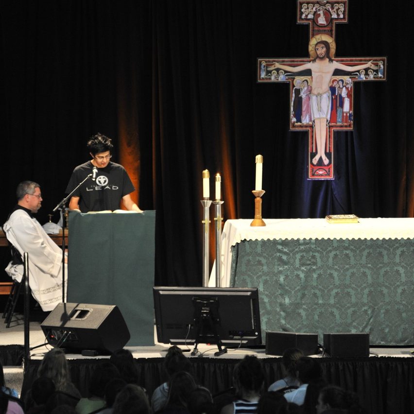 lead student doing the mass reading at main campus 1, 2015