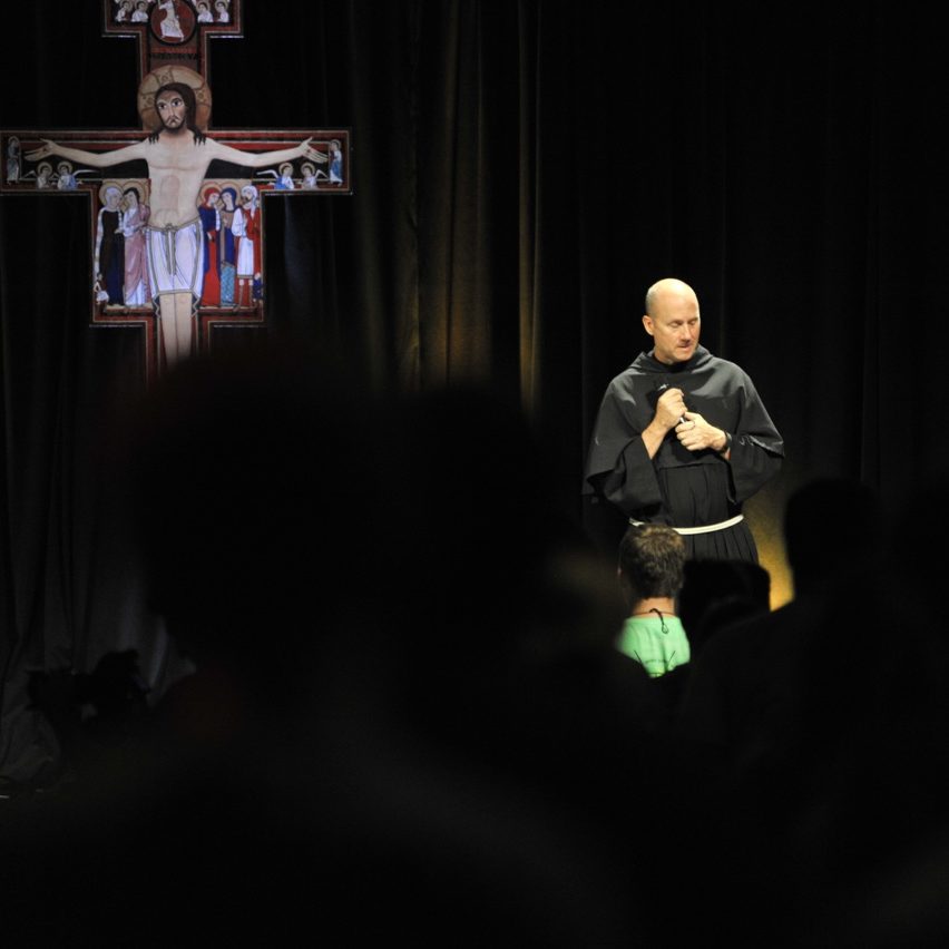 Fr. Dave on stage at main campus 1, 2015