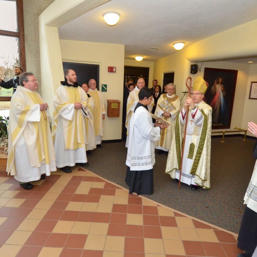 bishop montforton in christ the king chapel before he opens the holy door