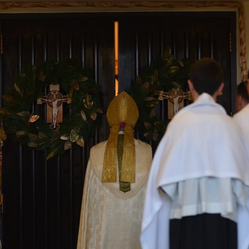 Bishop Montforton opening the holy door