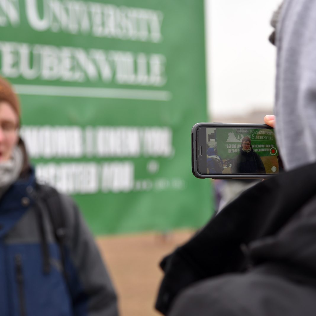 student recording another student at the march for life