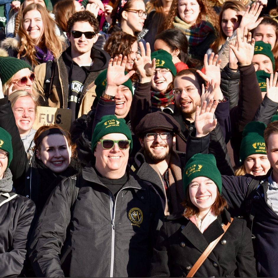 students gather for a picture at the march for life