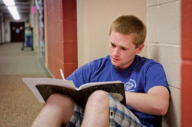 student studying Egan Hallway