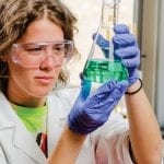 student working with chemicals