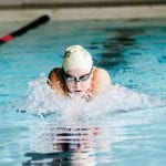 student swimming