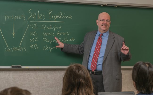 Business teacher in class