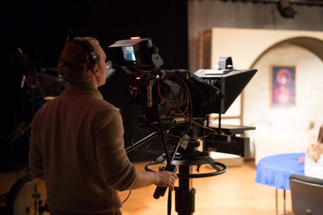 Student operating video camera