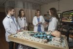 Nursing Student Around nursing dummy