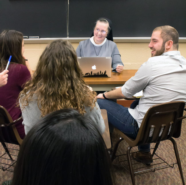 Sister Paruch working with students