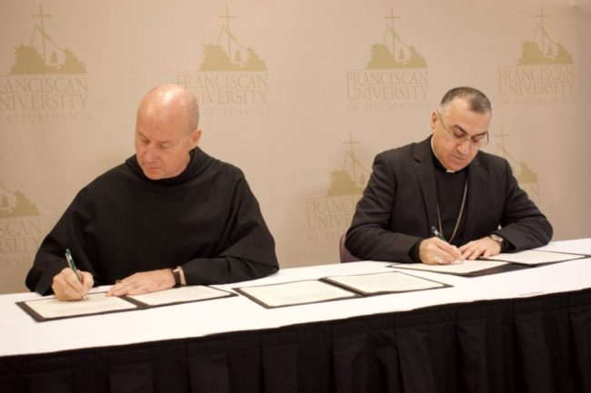 Fr. Dave Pivonka & Archbishop Bashar Warda signing