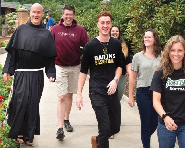 Father Dave Walking with Students