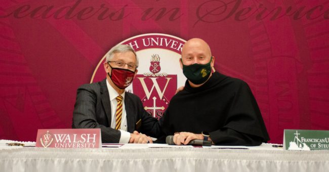 Dr. Timothy J. Collins, president of Walsh University, and Father Dave Pivonka, TOR, president of Franciscan University of Steubenville, signed memorandums of understanding at a special ceremony at Walsh University.