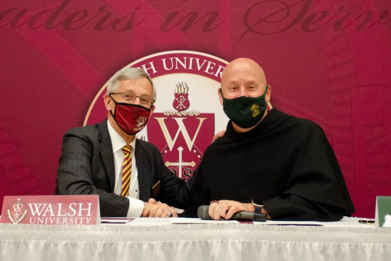 Dr. Timothy J. Collins, president of Walsh University, and Father Dave Pivonka, TOR, president of Franciscan University of Steubenville, signed memorandums of understanding at a special ceremony at Walsh University.