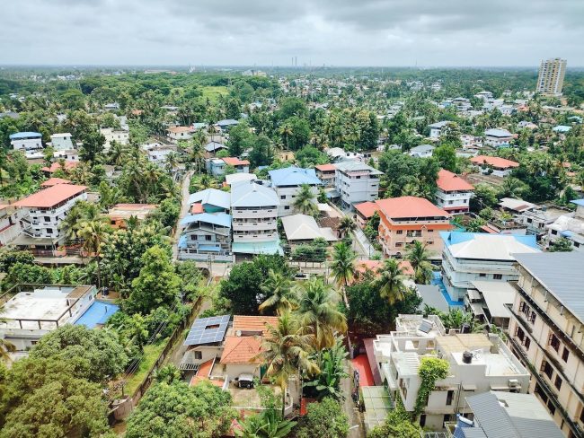 Overview of houses and trees in an Indian city.