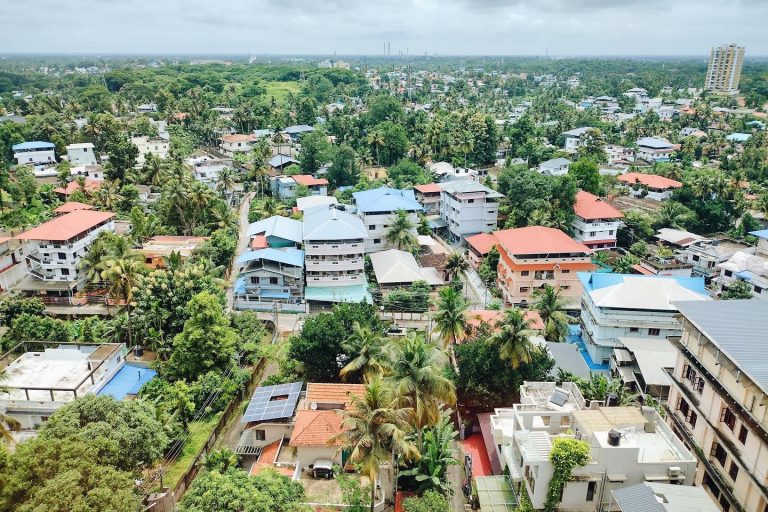 Overview of houses and trees in an Indian city.