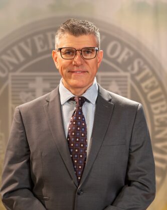 Professional headshot of Simon Kyne.