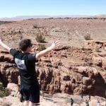 Student looking out over a massive desert