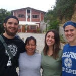 Students in front of a home