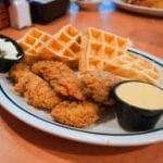 chicken and waffles on plate