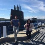 2 Students in front of a submarine