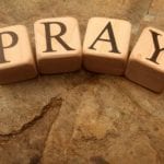 Pray on wooden blocks