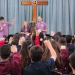 group on stage on mission