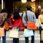 people carrying shopping bags