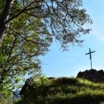 Metal Cross on Mountain in Europe