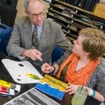 Professor helping in art